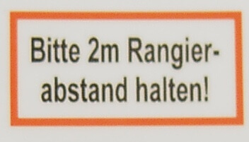 Textschild "Rangierabstand 2m" 2-zeilig  selbstklebende     