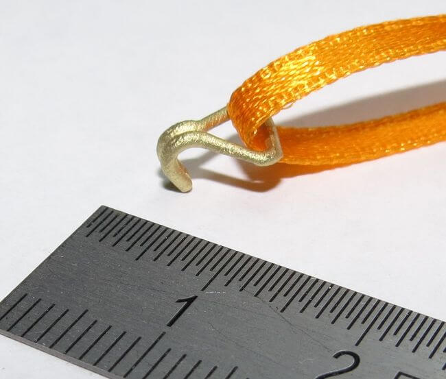 1 Set aus 4 Doppelhaken, gross. Messing- Feinguss und