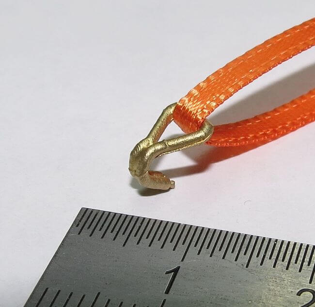 1 Set aus 4 Doppelhaken, klein. Messing- Feinguss und