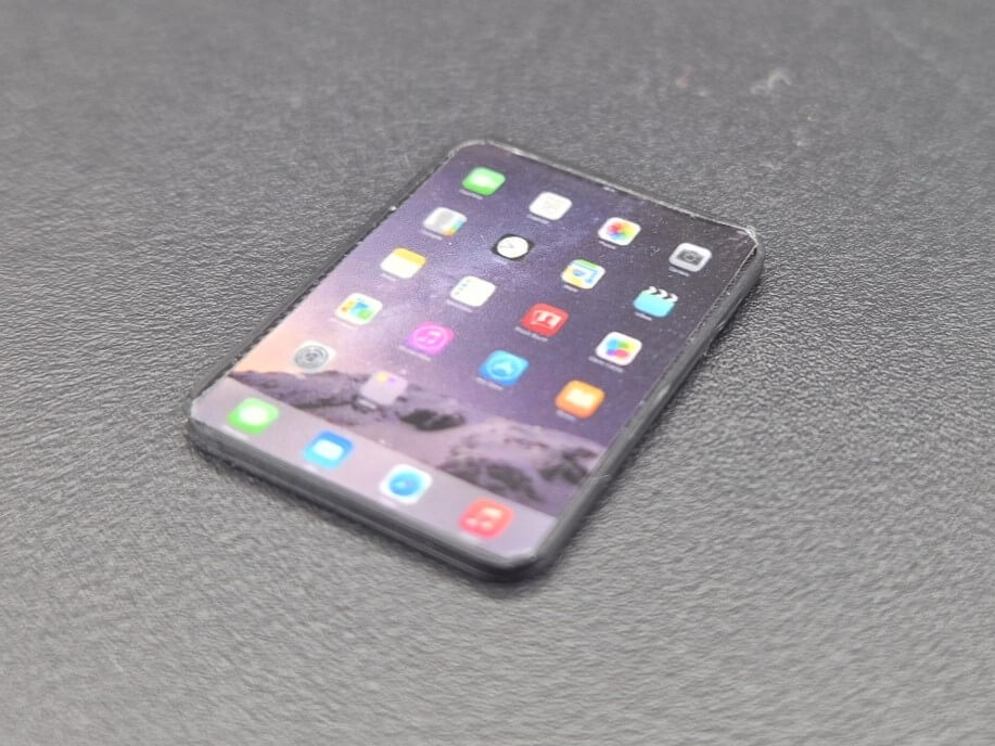 Tablet ca. 22x11 mm, Kunststoff, schwarz. Apple